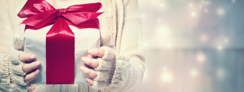 Woman holding a christmas present